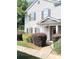 Home's entrance with well-maintained landscaping around the front entrance of the townhome at 1911 Flushing Ct, Charlotte, NC 28215