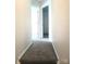 Carpeted hallway with white walls and door frames at 1911 Flushing Ct, Charlotte, NC 28215