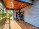 Cozy back deck with wood ceiling offering a tranquil view of the surrounding greenery and trees at 2004 Plain Field Dr, Bessemer City, NC 28016