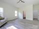 Clean bedroom with natural light, a comfortable armchair, and seamless access to the bathroom at 2004 Plain Field Dr, Bessemer City, NC 28016
