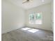 Bright bedroom features laminate flooring, a ceiling fan, and natural light from the double window at 2004 Plain Field Dr, Bessemer City, NC 28016