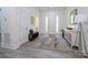 Bright foyer with light wood-look floors, white walls, and contemporary furnishings at 2004 Plain Field Dr, Bessemer City, NC 28016