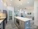 Spacious kitchen with island, stainless appliances, and open view into the living room at 2004 Plain Field Dr, Bessemer City, NC 28016