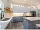 Bright kitchen featuring white countertops, gray cabinetry, and stainless steel appliances at 2004 Plain Field Dr, Bessemer City, NC 28016