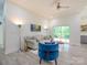 Bright living room with light wood floors, comfortable sofa, and a ceiling fan for added comfort at 2004 Plain Field Dr, Bessemer City, NC 28016