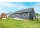 A spacious backyard features a fenced yard, a shed, a concrete patio and a lush green lawn at 201 S 5Th Ave, Maiden, NC 28650