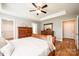 Inviting primary bedroom features a tray ceiling and hardwood floors at 201 S 5Th Ave, Maiden, NC 28650