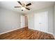 Bedroom featuring hardwood floors, a ceiling fan, and a double door closet at 201 S 5Th Ave, Maiden, NC 28650
