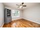 Bedroom with hardwood floors, a ceiling fan, and a window with blinds at 201 S 5Th Ave, Maiden, NC 28650