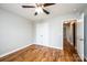 Bedroom featuring hardwood floors, a ceiling fan, and a double door closet at 201 S 5Th Ave, Maiden, NC 28650
