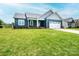 Beautiful one story home featuring navy siding, a two car garage, and a lush green lawn at 201 S 5Th Ave, Maiden, NC 28650