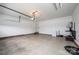 Spacious garage with painted walls, concrete flooring, and an automatic door opener at 201 S 5Th Ave, Maiden, NC 28650