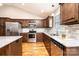 Well lit kitchen featuring stainless steel appliances, granite counters, and hardwood floors at 201 S 5Th Ave, Maiden, NC 28650