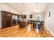 Kitchen featuring stainless steel appliances, a center island, wood cabinets, and dining table at 201 S 5Th Ave, Maiden, NC 28650