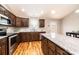 Close up of the kitchen sink, granite counters, wood cabinets, and stainless steel appliances at 201 S 5Th Ave, Maiden, NC 28650