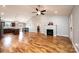 Spacious living area features hardwood flooring, kitchen, fireplace and vaulted ceilings at 201 S 5Th Ave, Maiden, NC 28650