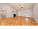 Sunlit living area showcases hardwood floors, a fireplace, and vaulted ceilings at 201 S 5Th Ave, Maiden, NC 28650