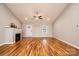 Inviting living room boasts hardwood floors, fireplace, and large windows for ample natural light at 201 S 5Th Ave, Maiden, NC 28650