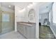 Elegant bathroom with dual vanities, granite countertops, and a glass enclosed shower at 228 Coneflower Pl, Fort Mill, SC 29708