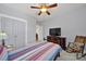 Bedroom featuring a ceiling fan, closet, and hardwood floors at 228 Coneflower Pl, Fort Mill, SC 29708