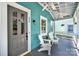 Inviting front porch with comfortable seating, ceiling fans, and a painted gray floor at 228 Coneflower Pl, Fort Mill, SC 29708