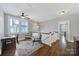 Upstairs landing area with desk, seating, ceiling fan, and hardwood floors at 228 Coneflower Pl, Fort Mill, SC 29708
