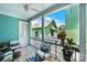 A lovely porch with comfortable seating offers a relaxing outdoor space with a green house in the background at 228 Coneflower Pl, Fort Mill, SC 29708