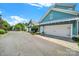 Street view shows a blue house with a white garage door on a sunny day at 228 Coneflower Pl, Fort Mill, SC 29708