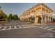 Charming street view of a mixed-use building with balconies, retail spaces, and street-level access at 228 Coneflower Pl, Fort Mill, SC 29708