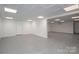 Finished basement with a decorative drop ceiling and an exterior door to the yard at 2817 Long Cir # 1, Iron Station, NC 28080