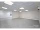 Finished basement with a decorative drop ceiling and plenty of space for storage or recreation at 2817 Long Cir # 1, Iron Station, NC 28080