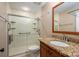 Bathroom featuring a glass shower, granite countertop vanity, and a bright, well-lit space at 2817 Long Cir # 1, Iron Station, NC 28080