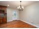 Dining room featuring hardwood floors, a chandelier, and a door to the backyard at 2817 Long Cir # 1, Iron Station, NC 28080
