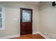 Elegant entryway with a decorative glass front door and hardwood floors at 2817 Long Cir # 1, Iron Station, NC 28080