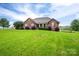 Beautiful brick home with a well-kept lawn and mature trees offers privacy at 2817 Long Cir # 1, Iron Station, NC 28080