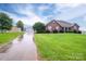 Picturesque brick home on large lot with driveway leading to storage units at 2817 Long Cir # 1, Iron Station, NC 28080