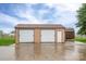 Two-car detached garage with doors and a separate storage shed at 2817 Long Cir # 1, Iron Station, NC 28080