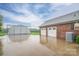 Garage with a two-car entrance and a large metal building at 2817 Long Cir # 1, Iron Station, NC 28080