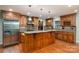 Spacious kitchen with wood cabinets, granite countertops, stainless steel appliances, and a large kitchen island at 2817 Long Cir # 1, Iron Station, NC 28080