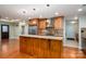 Gourmet kitchen with granite island, custom cabinetry, and stainless steel appliances at 2817 Long Cir # 1, Iron Station, NC 28080