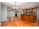 Open kitchen with granite countertops, stainless steel appliances, and center island at 2817 Long Cir # 1, Iron Station, NC 28080