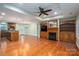 Open concept living space includes fireplace, built-in cabinets, and access to the kitchen at 2817 Long Cir # 1, Iron Station, NC 28080
