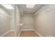 Spacious walk-in closet featuring white shelving and ample storage space for optimal organization at 2817 Long Cir # 1, Iron Station, NC 28080