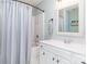 Inviting bathroom features a shower-tub combo with modern fixtures and a decorative mirror at 2945 Duvalla Ave, Charlotte, NC 28209