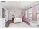 Stylish bedroom designed with a pink theme, featuring a white bed and modern decor at 2945 Duvalla Ave, Charlotte, NC 28209