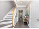 Inviting entryway featuring tile flooring, a staircase, and neutral wall colors at 2945 Duvalla Ave, Charlotte, NC 28209