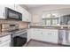 Stylish kitchen with stainless steel appliances, ample countertop space, and undermount sink at 2945 Duvalla Ave, Charlotte, NC 28209