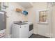 Convenient laundry room features a washer and dryer with easy access to the door at 2945 Duvalla Ave, Charlotte, NC 28209