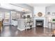 Open-concept living area with fireplace, hardwood floors, and access to the kitchen at 2945 Duvalla Ave, Charlotte, NC 28209