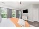 Bright main bedroom with hardwood floors, vaulted ceiling, and cozy bed at 2945 Duvalla Ave, Charlotte, NC 28209